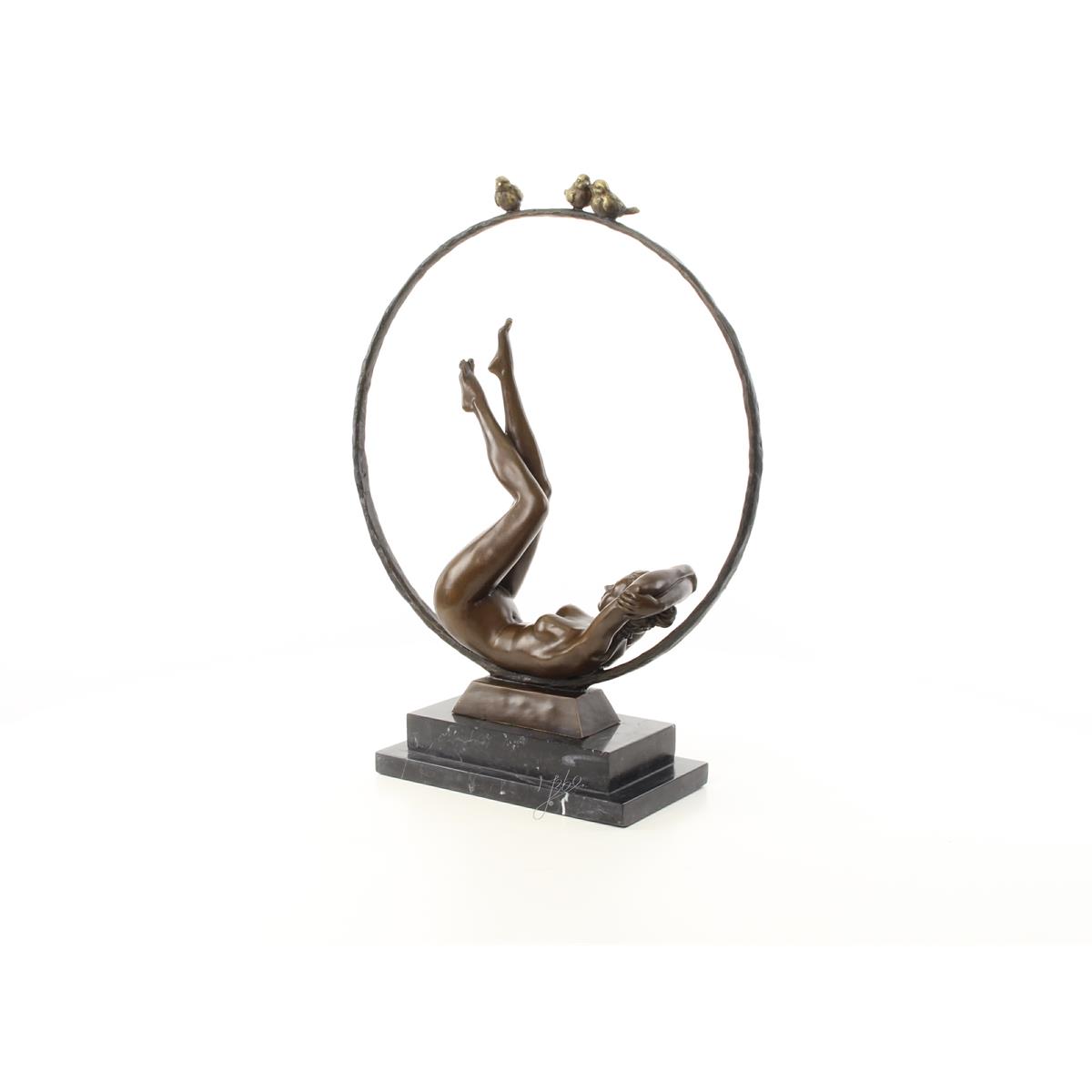 A BRONZE SCULPTURE OF A FEMALE NUDE WITH HOOP
