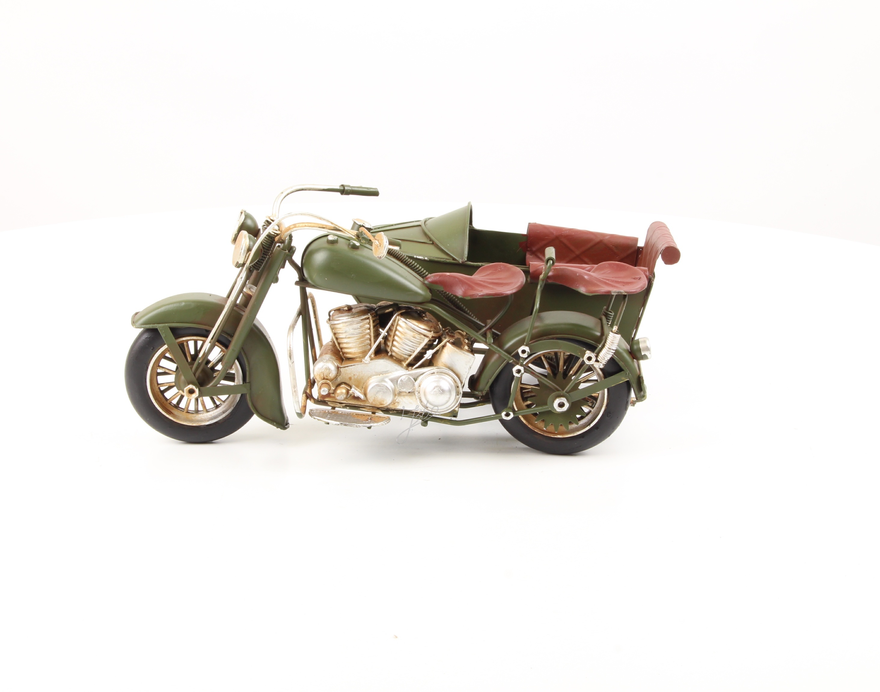A TIN MODEL OF A MOTORCYCLE WITH SIDECAR